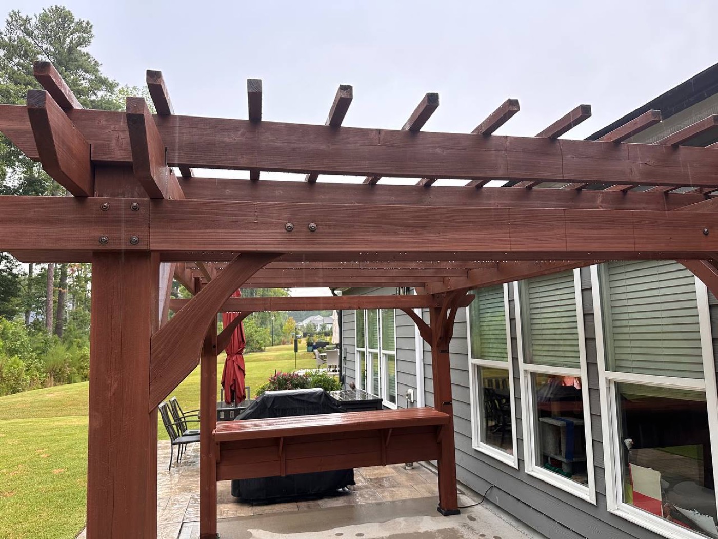 Pergola rafters with a fresh coat of stain