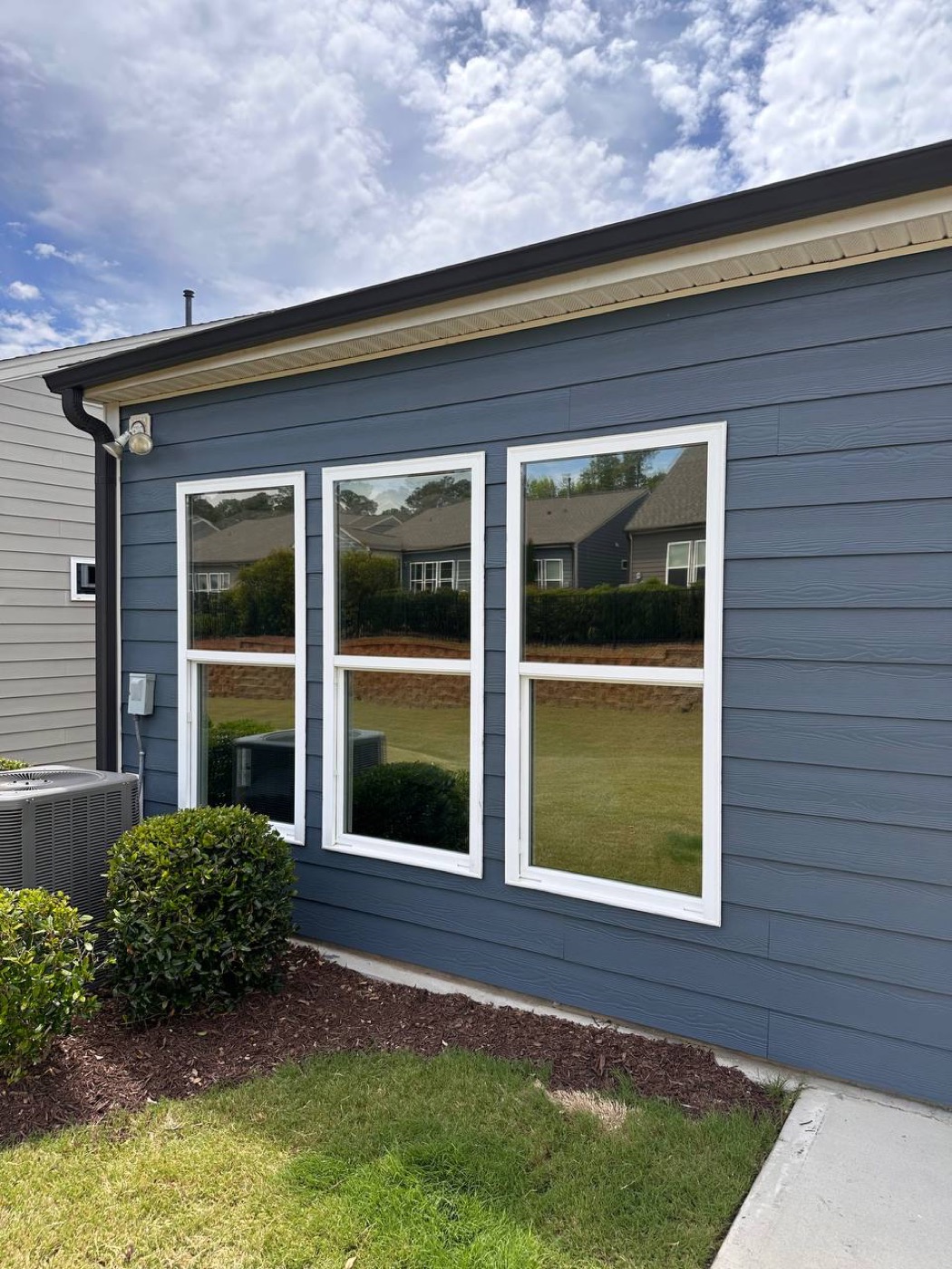 Freshly painted siding on the back of a home